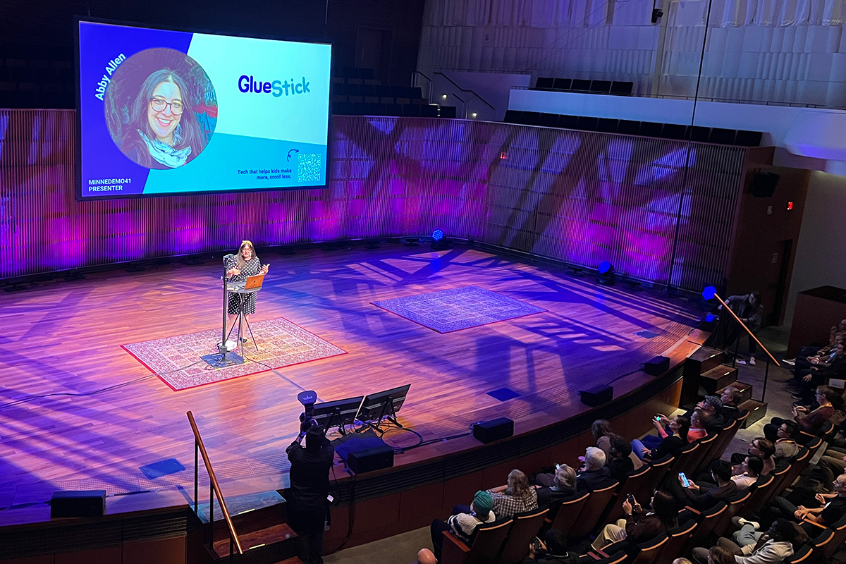 Abby Allen founder of Gluestick on stage at MinneDemo