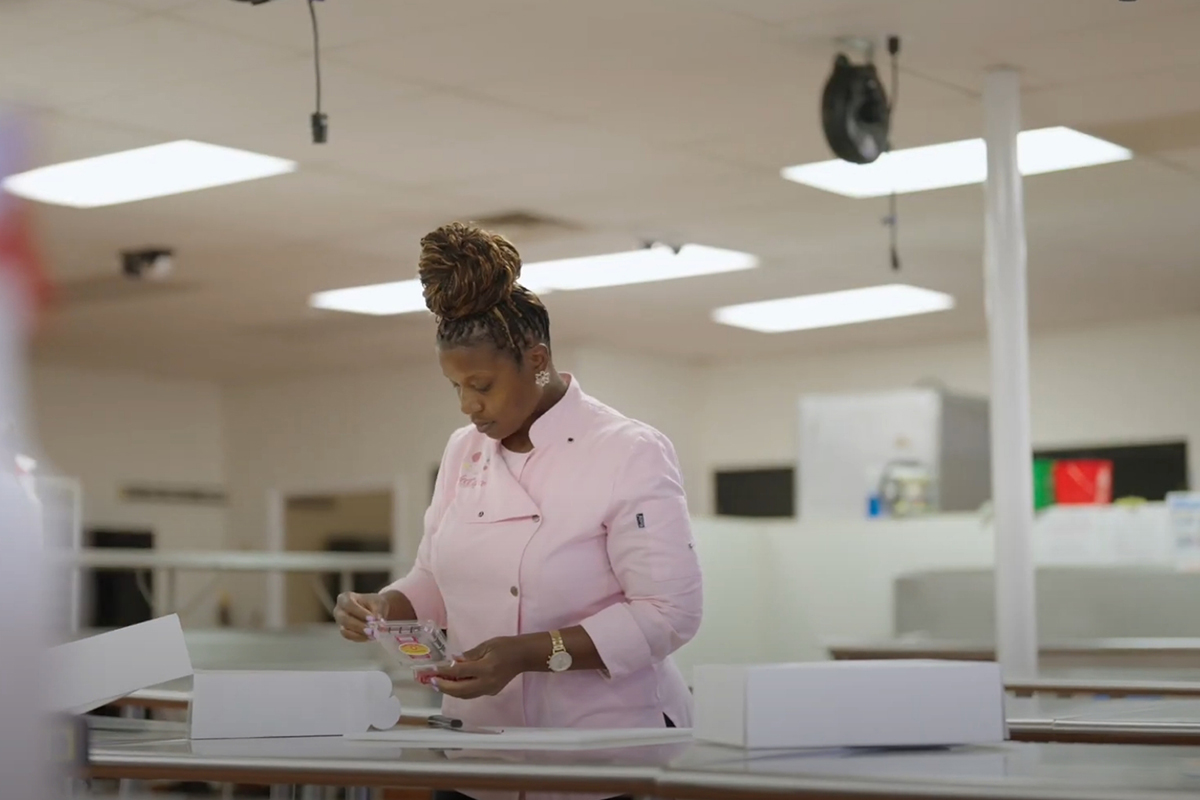 Melanie Lewis in her kitchen making treats for her business Perfect Piece Sweets Co.
