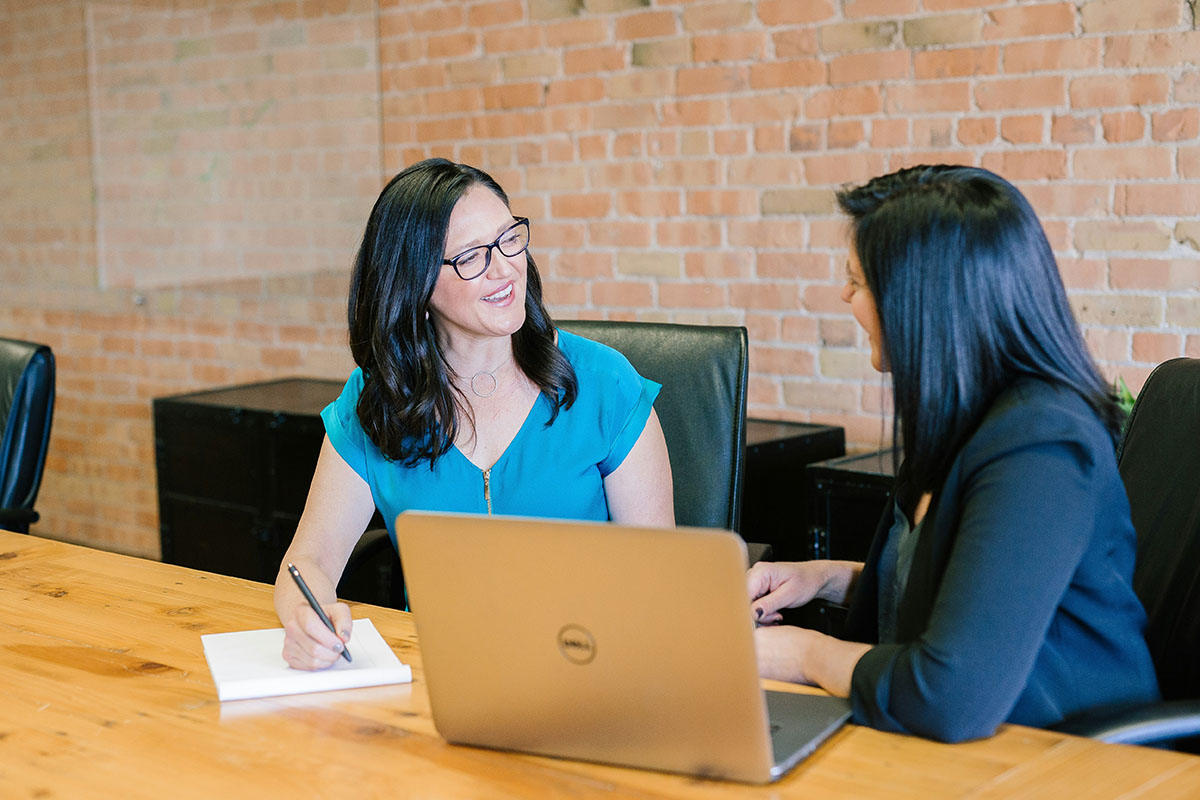 An Elevate Hennepin advisor working with a client.