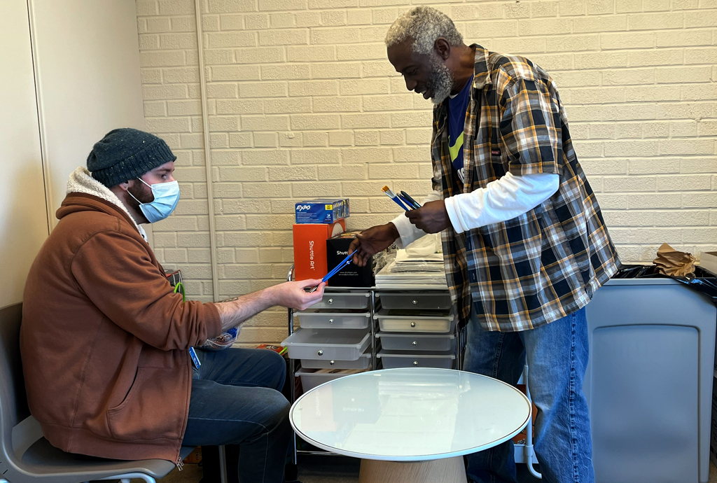 A patient and caregiver at a table