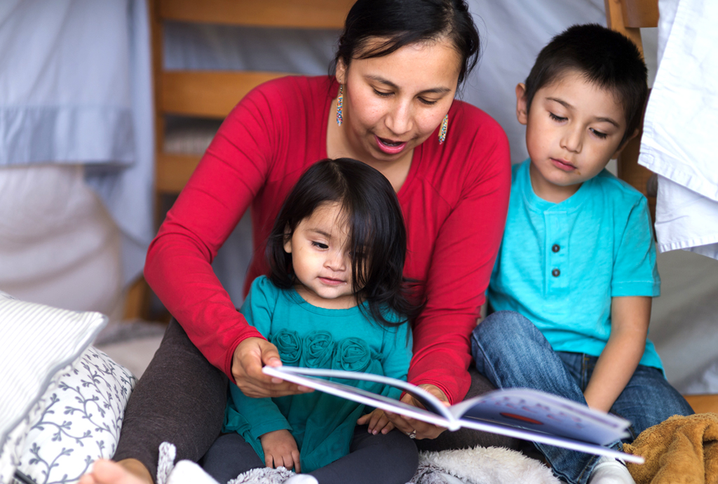 Native mom reading to kids