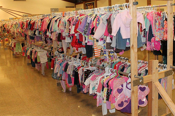 children's clothing hanging on clothes racks