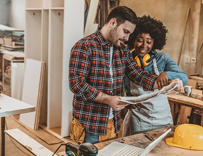 man and a women working on the inside of a house