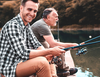 two men fishing off the dock