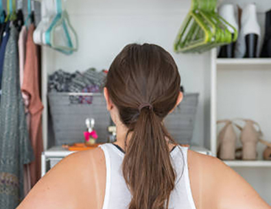 women standing in front of her closet