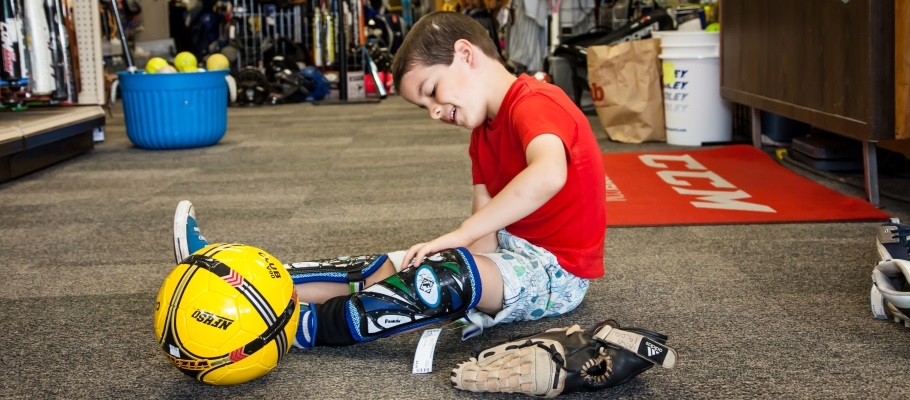Boy playing with sporting equipment