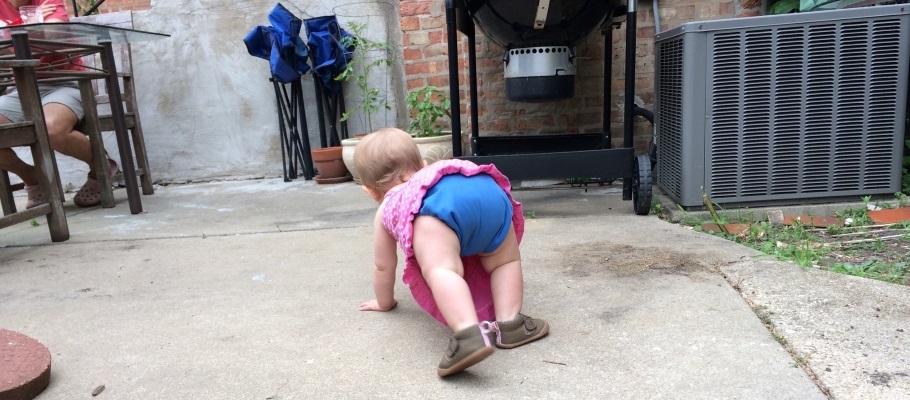 Baby with cloth diaper crawling