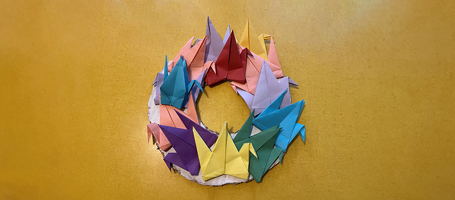 Kids art wreath made out of origami swans