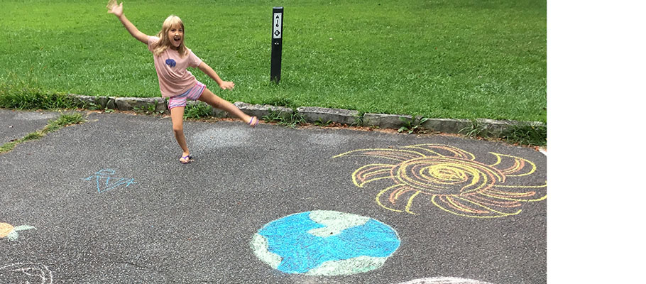 Kids art sidewalk chalk art of sun and moon