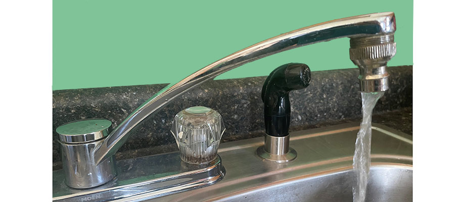 Tap on sink with running water