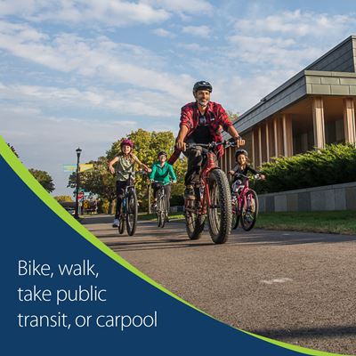 Picture of family biking with text that says bike, walk, take transit, or carpool