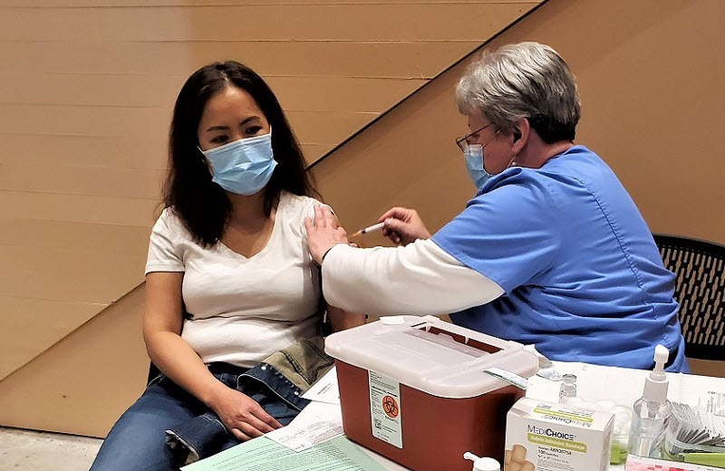 Community member receiving COVID-19 immunization