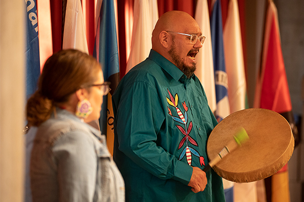 welcome and honor song with flags in background