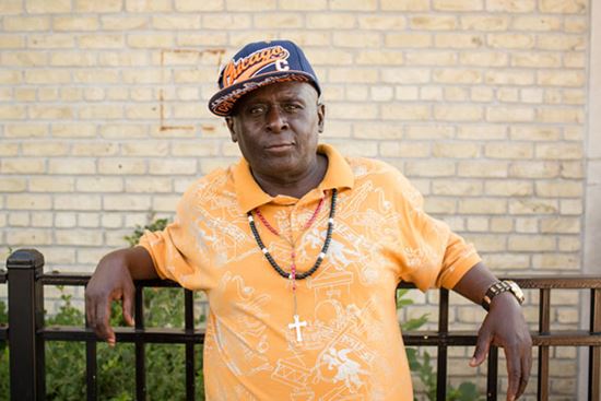 man in front of his apartment