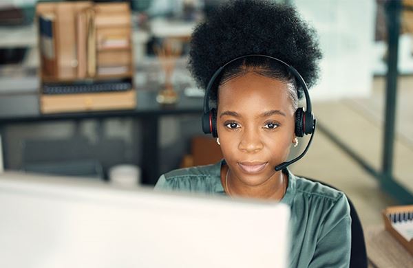 girl sitting down with headset on